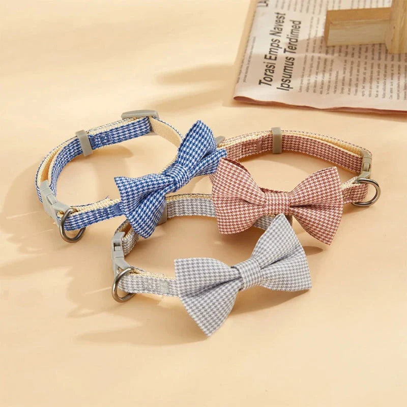 Stylish checkered pet collar with elegant butterfly knot decoration, perfect for dressing up cats and dogs