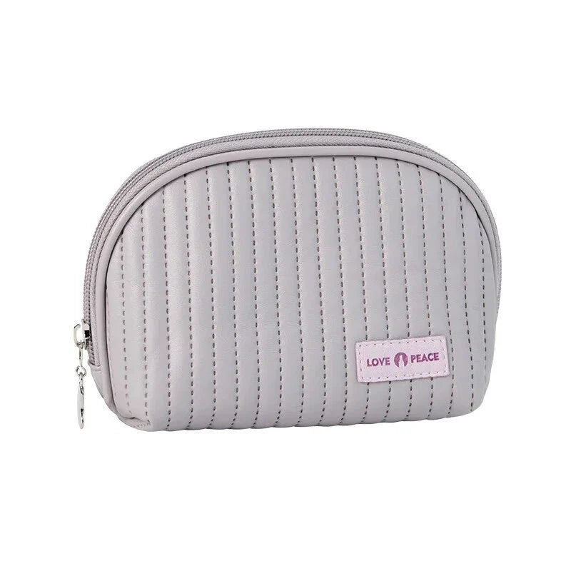 Compact Shell Cosmetic Bag for Women - A stylish and functional makeup pouch for the modern British woman