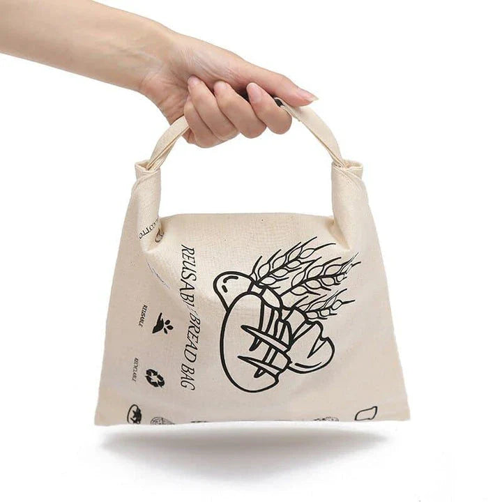 Organic cotton bread bag with dual-layer design for enhanced insulation and moisture control, preserving the freshness of homemade or artisanal breads.