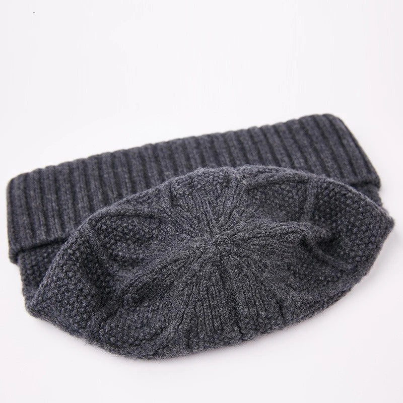 Premium knitted hat in various colours with a dome-shaped design, concave stripe pattern, and adjustable fit for warm outdoor fashion