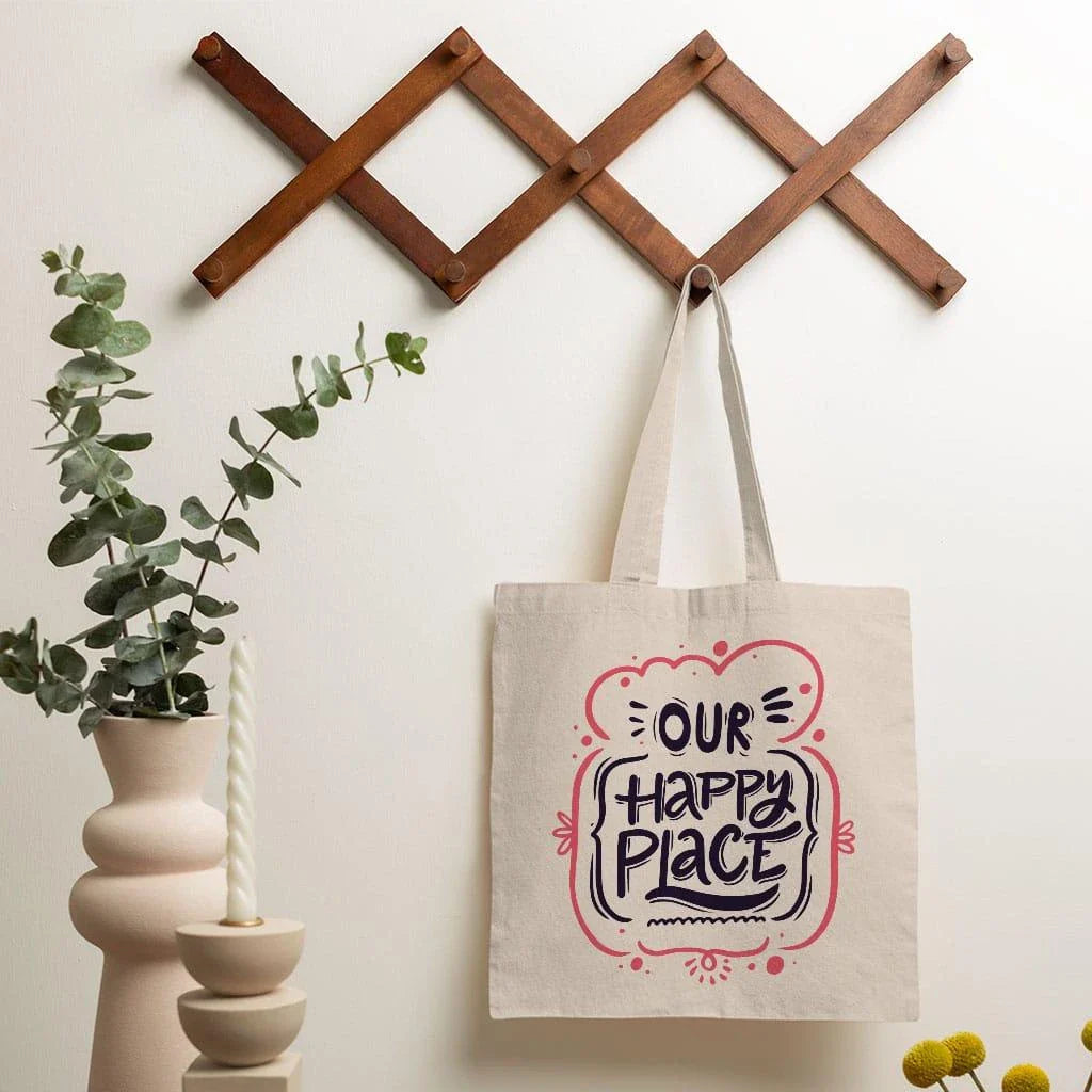Charming small tote bag in black with stylish cotton handles, perfect for everyday use and carrying essential items.