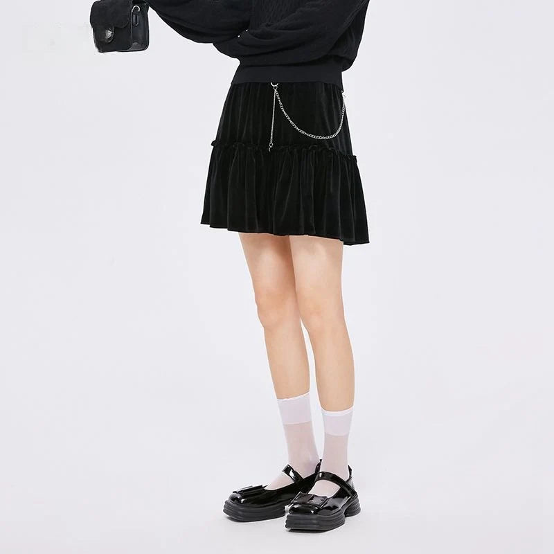 A stylish and playful above-knee mini skirt with intricate chain detailing, offering a versatile and fashionable addition to any wardrobe.