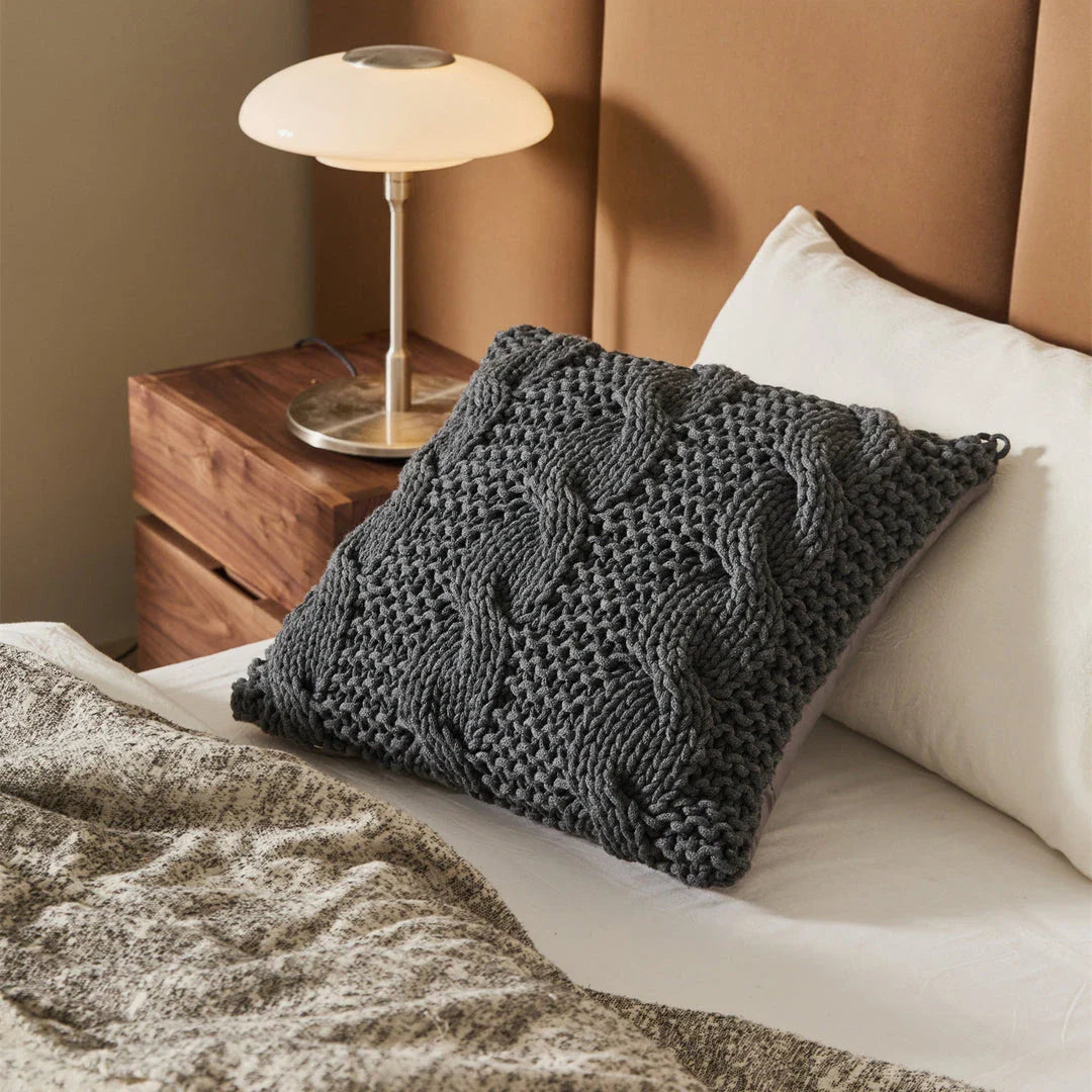 Luxurious hand-crocheted chunky knit throw pillow in a range of vibrant colours, providing cosy comfort and sophisticated style.