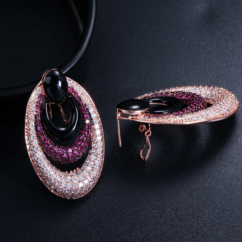 Elegant water drop-shaped ear studs in a vibrant red hue, adorned with a micro-inlaid zircon gemstone for a dazzling, sophisticated look.