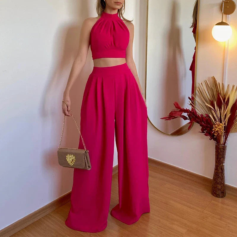 A stylish two-piece set with a halter-neck top and relaxed, high-waisted trousers in a range of sophisticated colours
