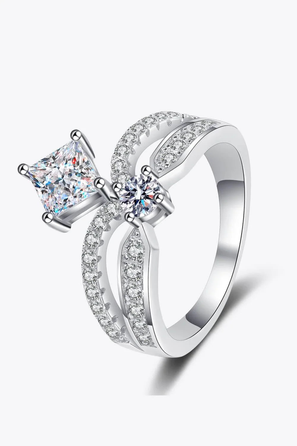 Elegant sterling silver ring with a moissanite centre stone and zircon accents, featuring a modern and minimalist crown design
