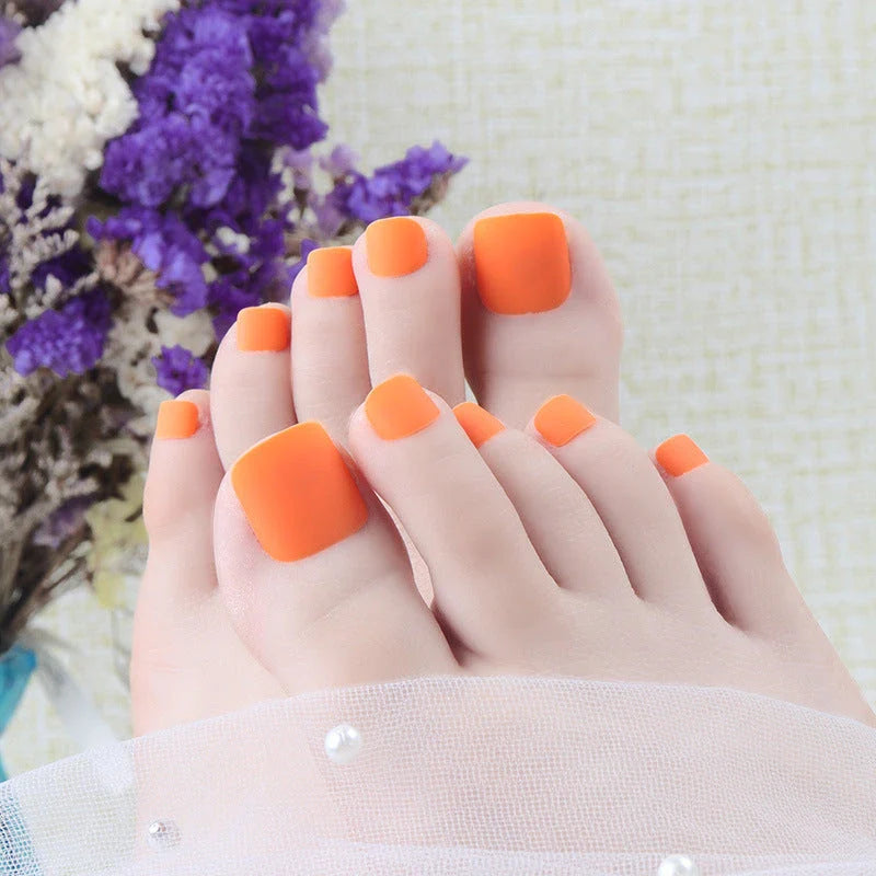 Premium white matte full coverage press-on toenails with secure adhesive for a flawless at-home pedicure