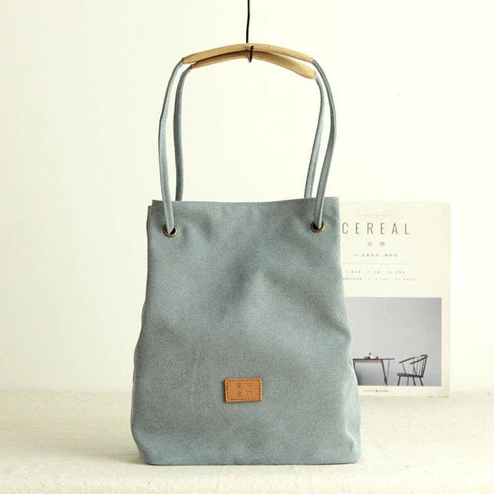 Premium canvas lattice shoulder bag in various colours, featuring a spacious design with secure zipper closure and adjustable strap for comfortable everyday carry