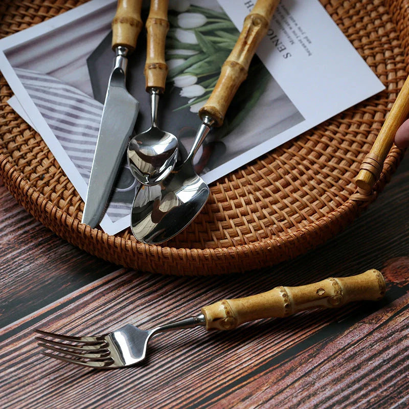 Mirror finish stainless steel cutlery set with bamboo handles, designed for elegant dining experiences
