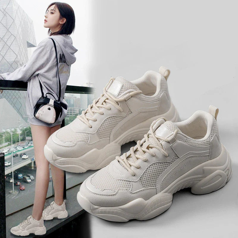 Stylish white platform casual shoes for women, featuring a round toe, thick heel, and comfortable, supportive design.