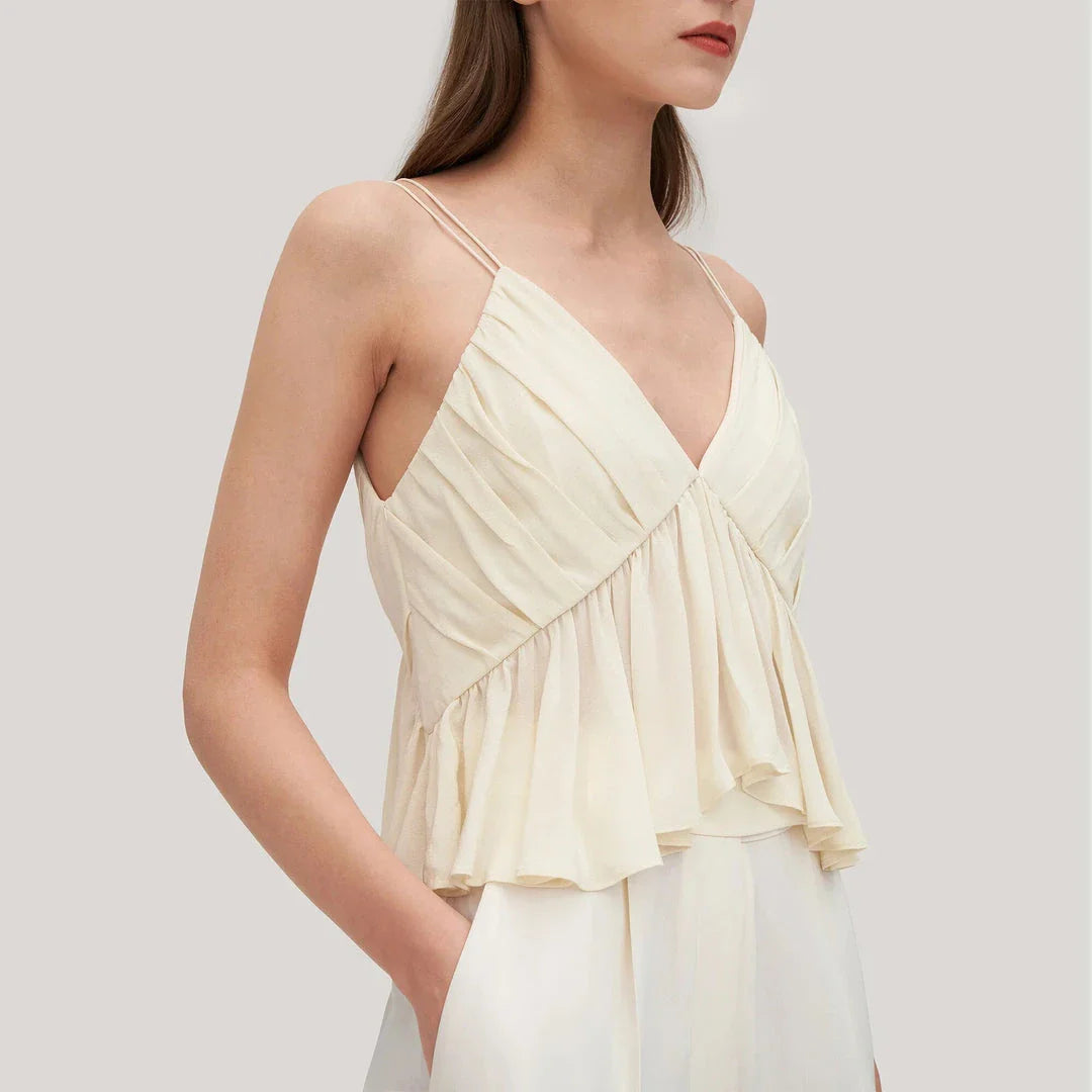Elegant and refined silk camisole with V-neck design and delicate spaghetti straps, perfect for the modern British fashion enthusiast