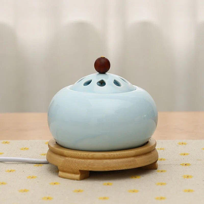 Elegant electric incense burner with adjustable temperature and timer function, perfect for creating a soothing ambiance in your home.