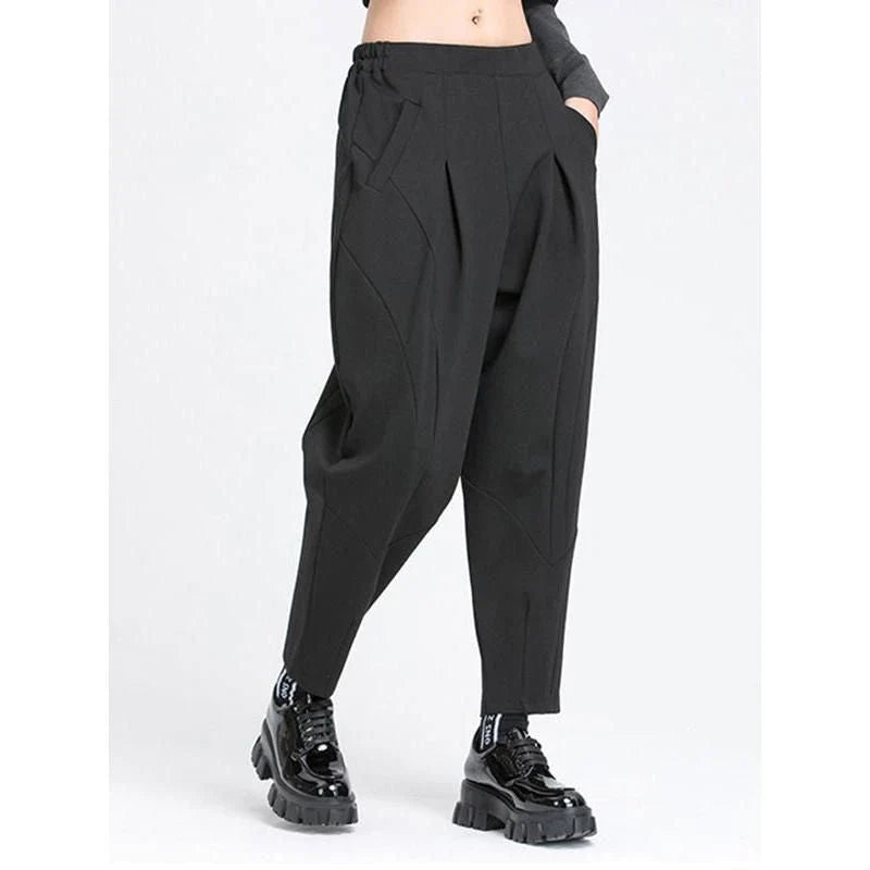 Stylish high elastic waist black harem trousers with a split joint design, offering a comfortable and fashionable look