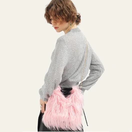Soft, plush lime-coloured faux fur bucket bag with adjustable strap and chic chain decoration