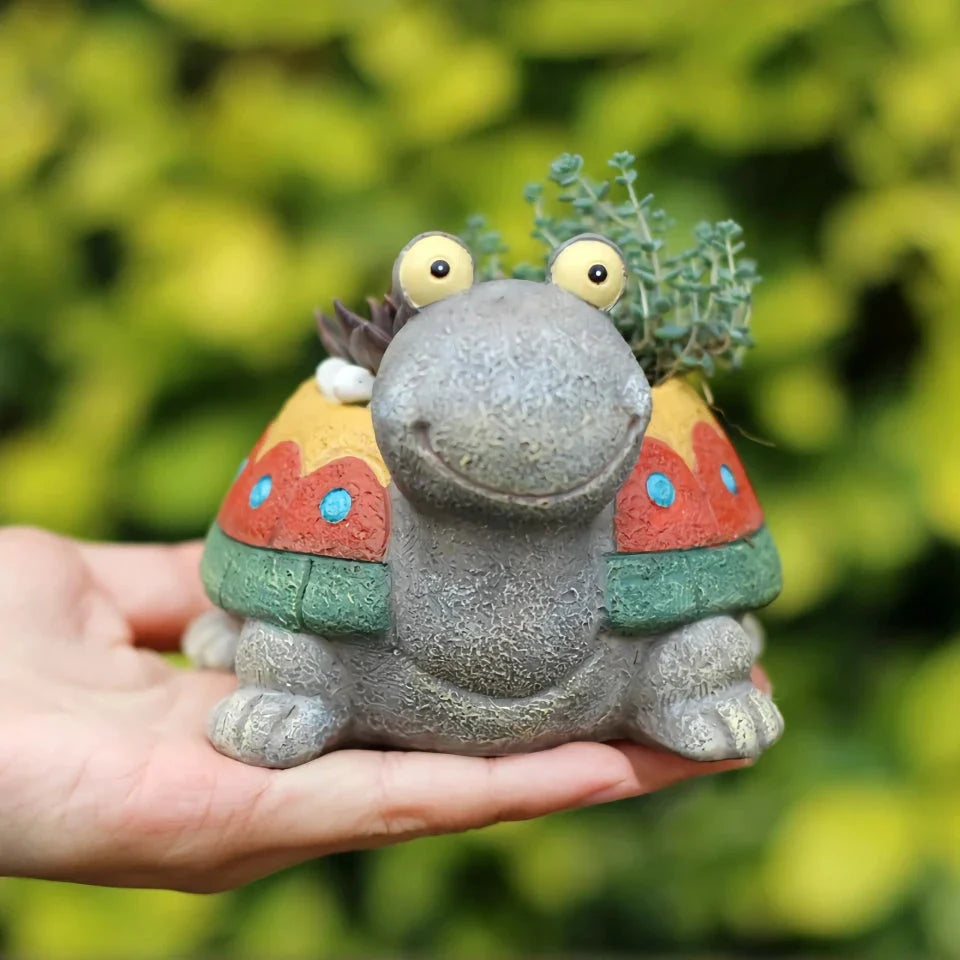 A charming, hand-painted resin planter in the shape of a cartoon turtle, perfect for displaying succulents, cacti, and other small plants.