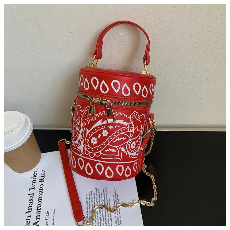 Premium PU leather bucket bag in a variety of classic and contemporary colours, featuring a spacious main compartment, adjustable shoulder strap, and sophisticated British-inspired design.