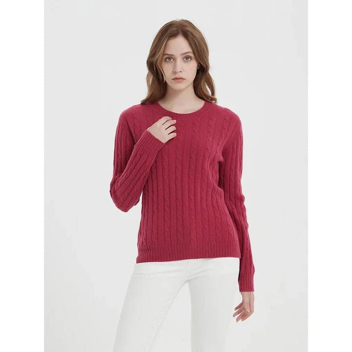 A luxurious 100% British wool cable knit jumper in a rich camel colour, perfect for keeping warm during the UK's chilly winters.