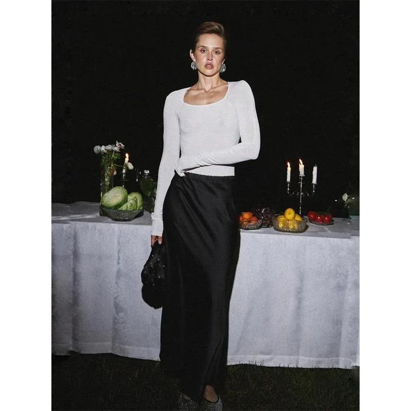 Sophisticated satin maxi skirt with adjustable waist, available in black colour and XS-L sizes