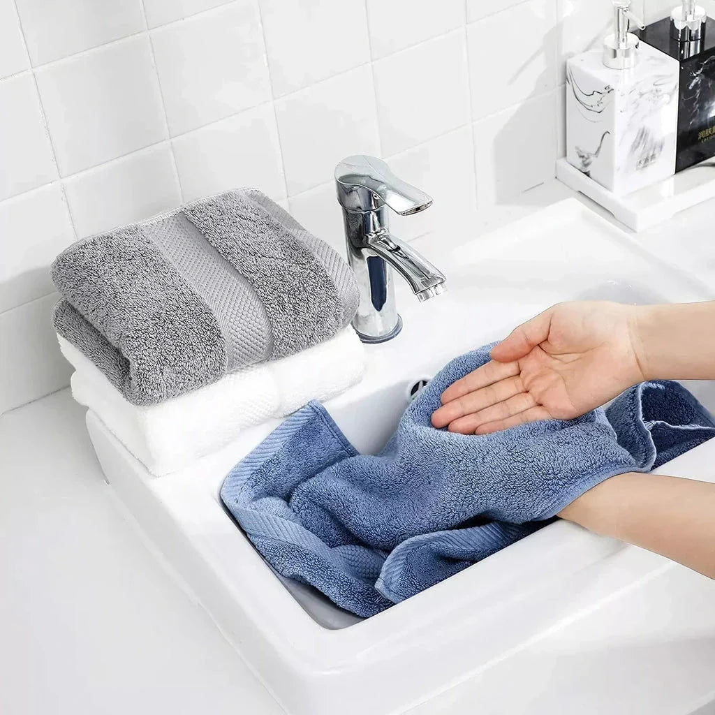 Premium 100% cotton face towel in blue, featuring a soft and absorbent design for daily facial cleansing and bathing