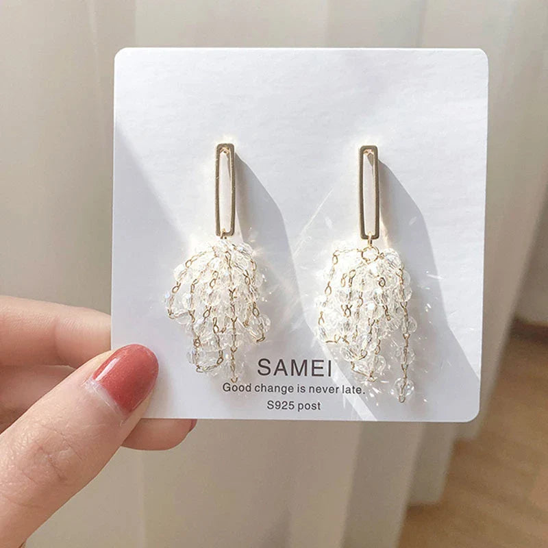 Elegant crystal grape cluster earrings with a cascading, geometric design in a premium gold finish