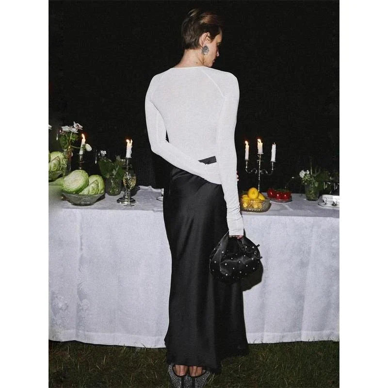 Sophisticated satin maxi skirt with adjustable waist, available in black colour and XS-L sizes