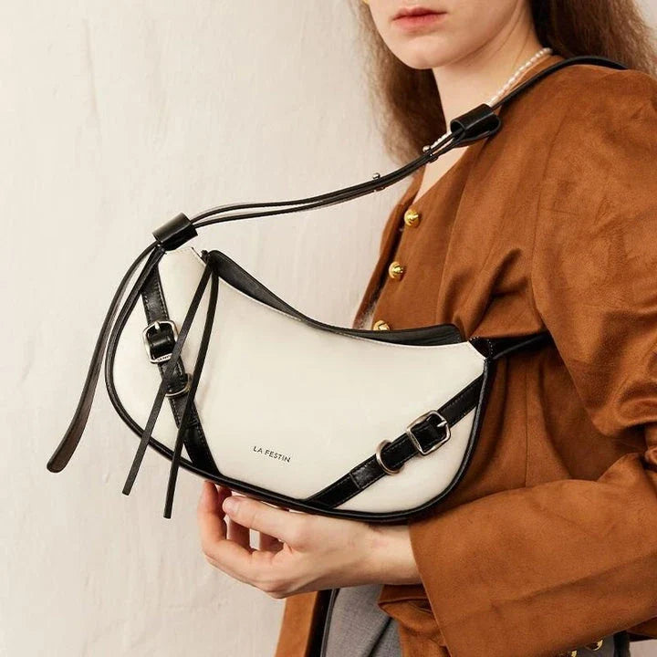 Elegant black shoulder and crossbody baguette bag made with premium split leather and synthetic lining