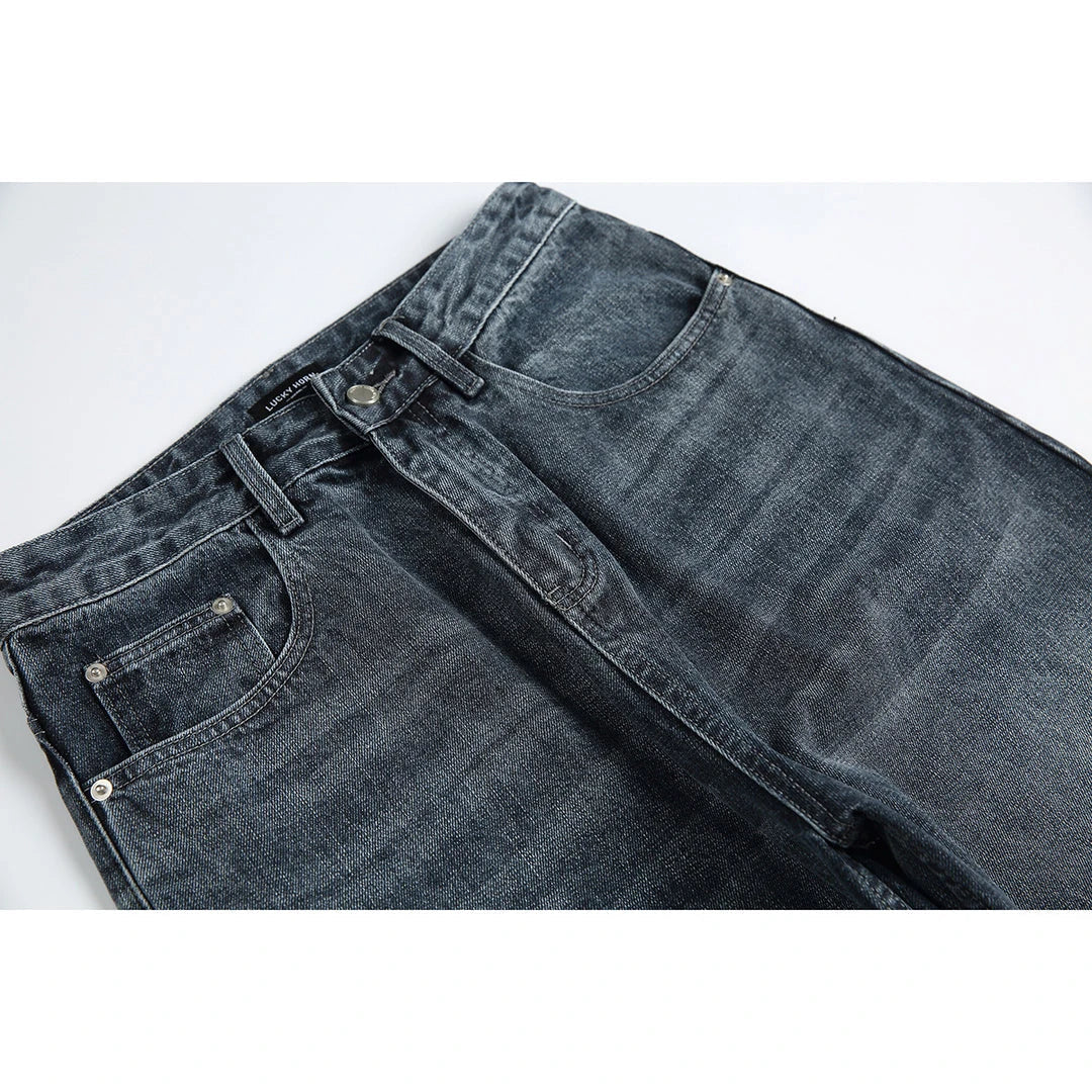 A pair of stylish retro-inspired Japanese jeans in black and grey, featuring a mid-rise waist and straight leg silhouette for a flattering, comfortable fit.