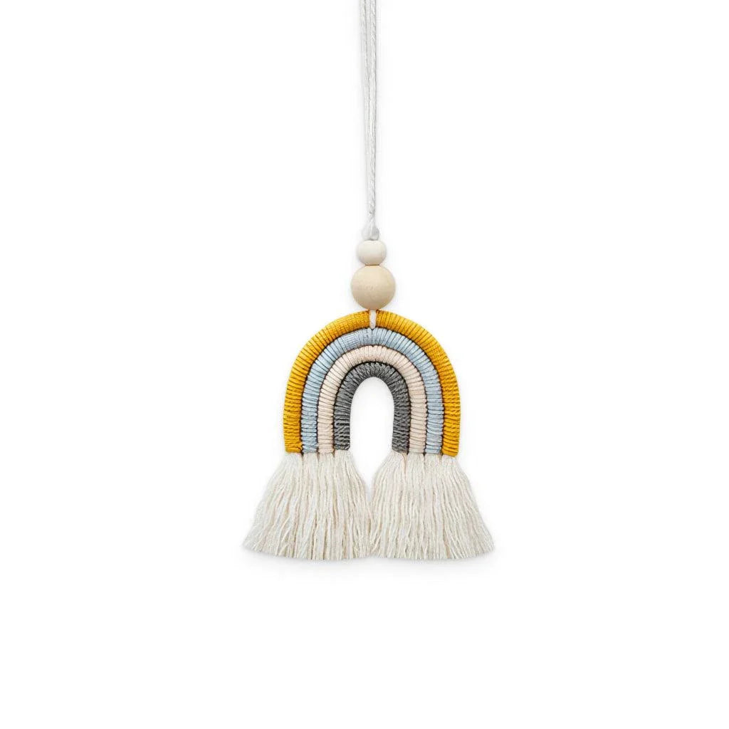 Bohemian-inspired cotton rainbow charm with wooden beads and tassels, a calming and cheerful home decor accent piece