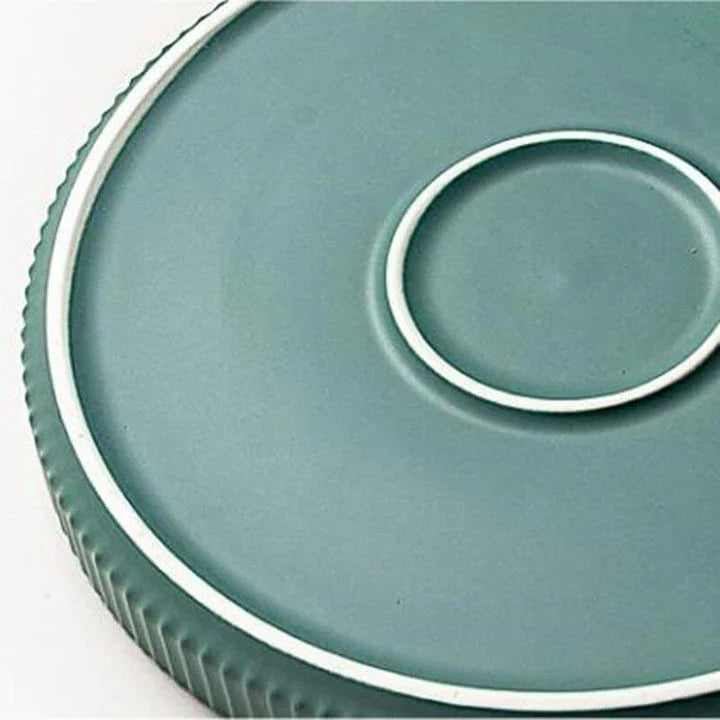 Candy-coloured ribbed ceramic tableware featuring plates, bowls, and other dining accessories in vibrant hues