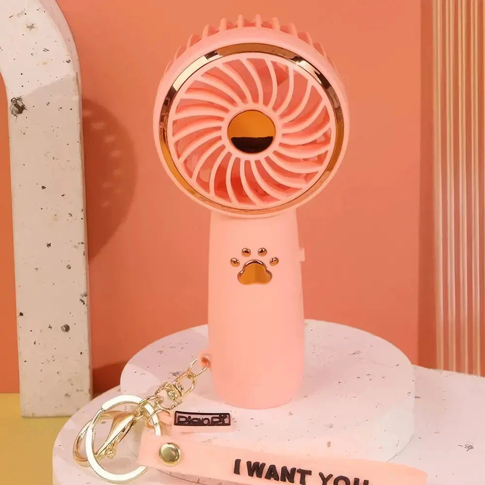 Compact, cartoon-themed USB handheld fan for keeping cool during the summer months