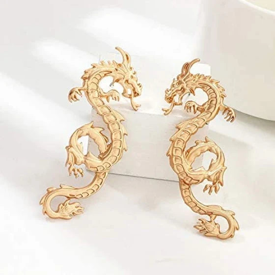 Stunning gold-coloured dragon stud earrings with intricate details, a fashionable accessory for UK customers