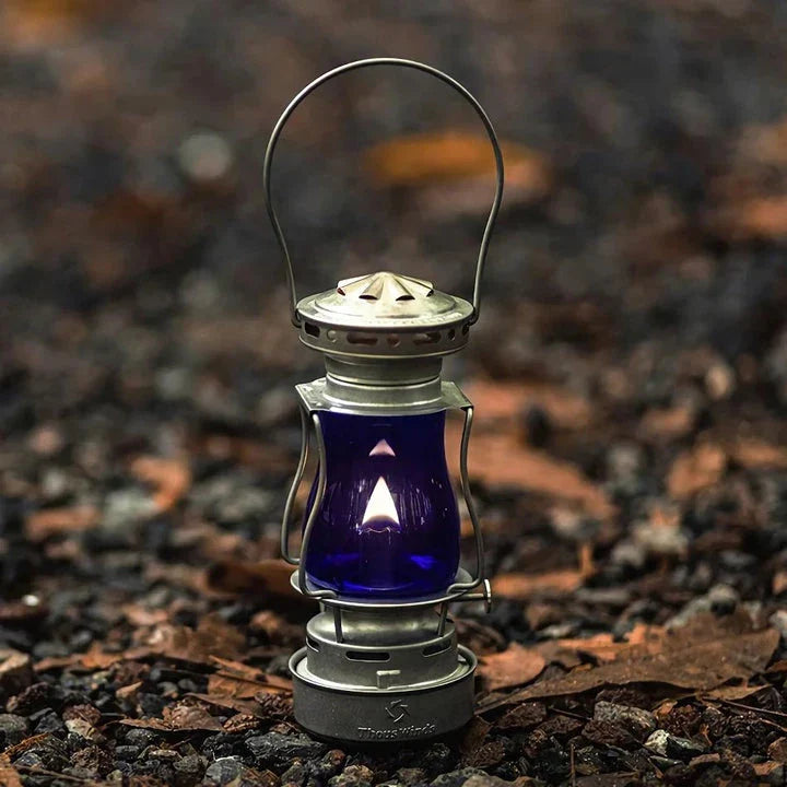 Classic vintage-inspired kerosene camping lamp with stainless steel construction and automatic ignition for reliable outdoor lighting