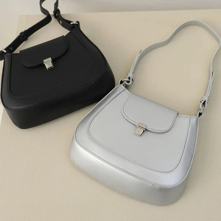 Elegant and versatile vegan leather shoulder bag with adjustable strap, flap cover, and interior pockets for modern British women