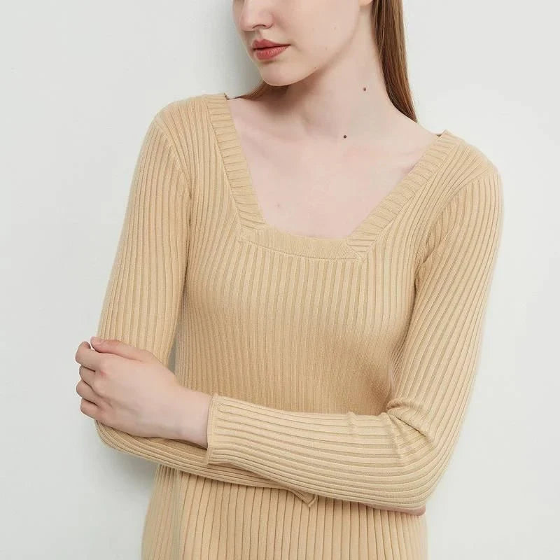 Elegant and cosy midi sweater dress in black, featuring a solid, body-hugging silhouette and comfortable knit fabric