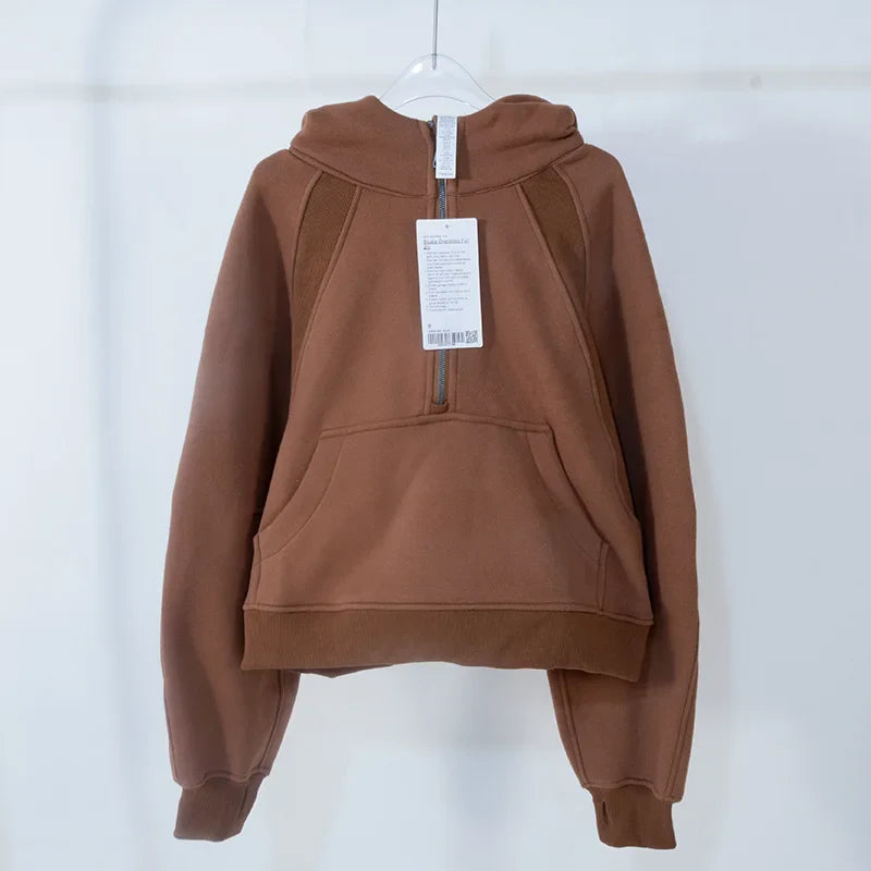 Premium women's sports fleece hoodie with half zip, available in a range of sophisticated colours