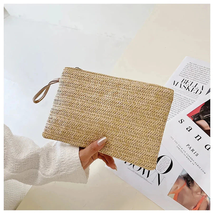A natural straw-woven clutch with a zipper closure, perfect for summer outings in the UK.