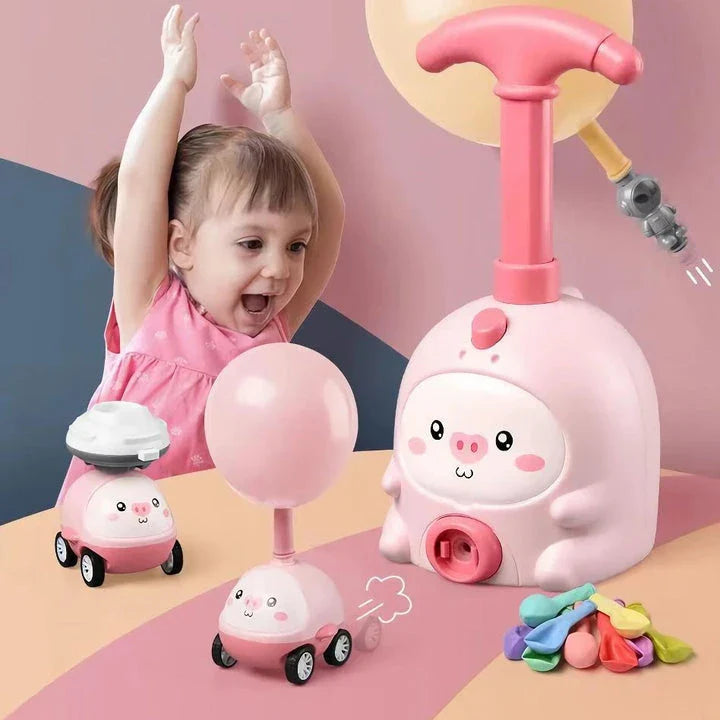 Balloon-powered launcher and car set for children, featuring a pink pig design and components for educational science play
