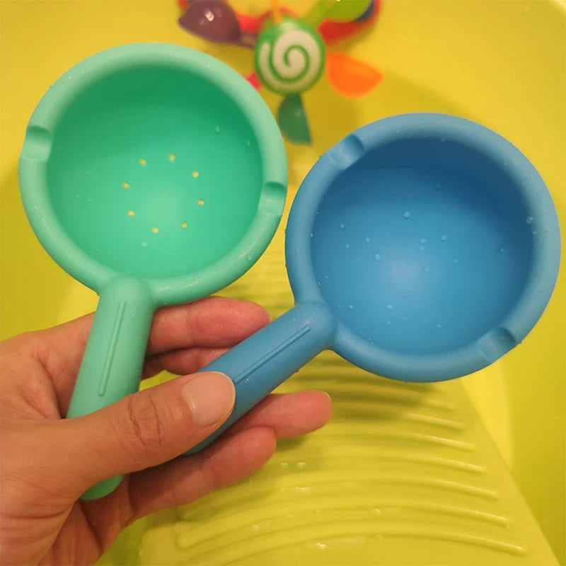 Colourful children's bath toy with a turning windmill and spoon for imaginative water play