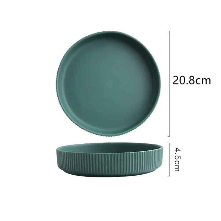 Candy-coloured ribbed ceramic tableware featuring plates, bowls, and other dining accessories in vibrant hues