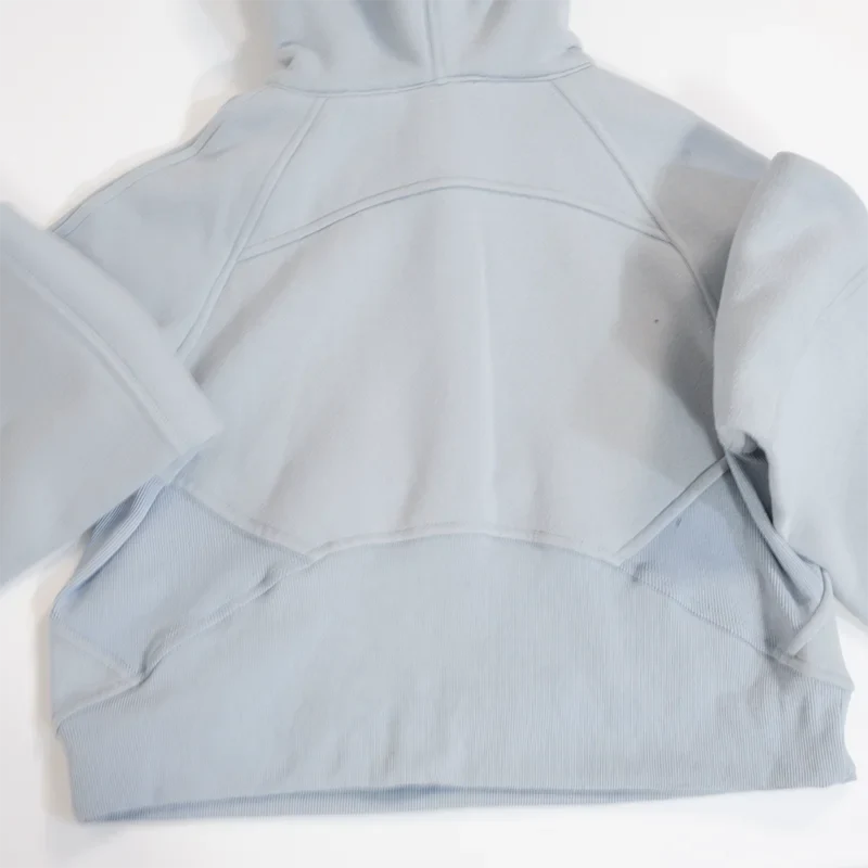 Premium women's sports fleece hoodie with half zip, available in a range of sophisticated colours