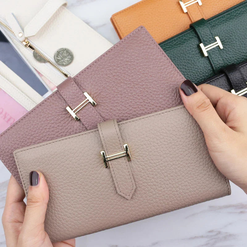 A stylish and practical long wallet made from premium leather, featuring a convenient drawstring closure to keep your essentials organised and secure.