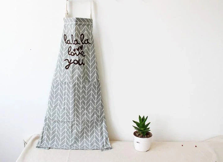Premium cotton printed kitchen apron with floral design, offering full coverage and adjustable fit for the discerning UK homemaker