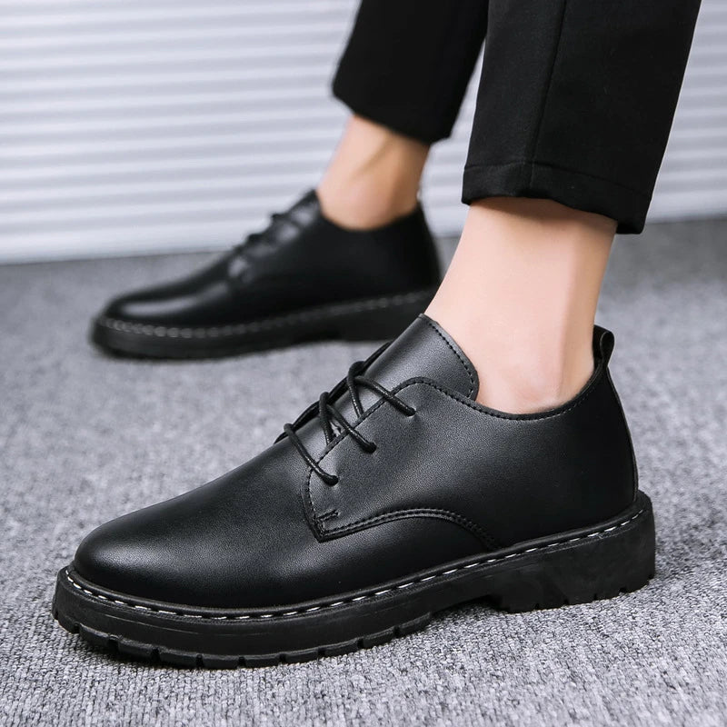 Sleek and sophisticated premium leather dress shoes in a dark skin black colourway, featuring a crocodile pattern and durable rubber sole