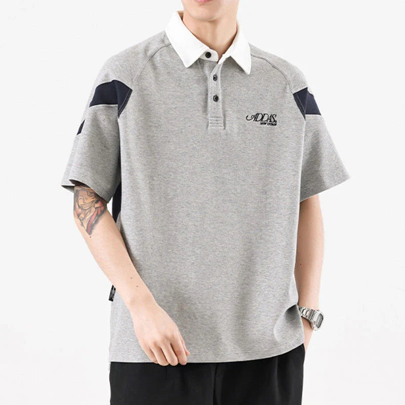 Melange grey polo shirt with contrast stitching, designed and made in Britain for comfortable summer wear