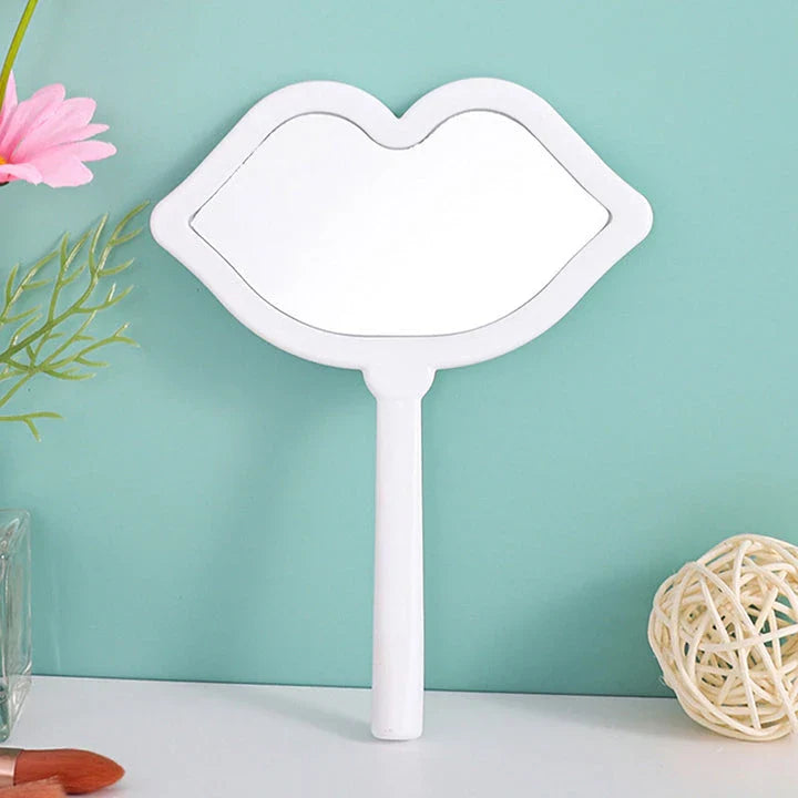 Lip-shaped handheld makeup mirror with a comfortable ergonomic handle for precise on-the-go touch-ups