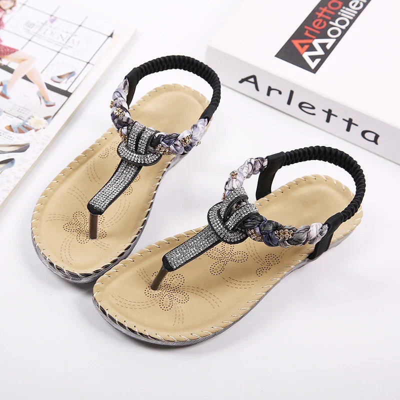 Stylish low-top toe sandals with two-layer leather upper, raw rubber sole, and rhinestone embellishments for chic British fashion