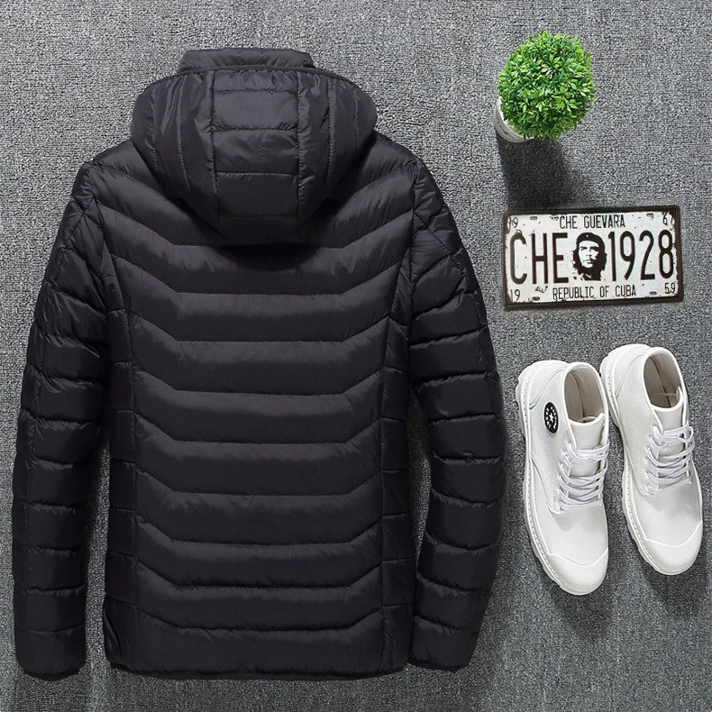 A stylish heated jacket with a removable hood, designed for warmth and comfort in chilly British weather.