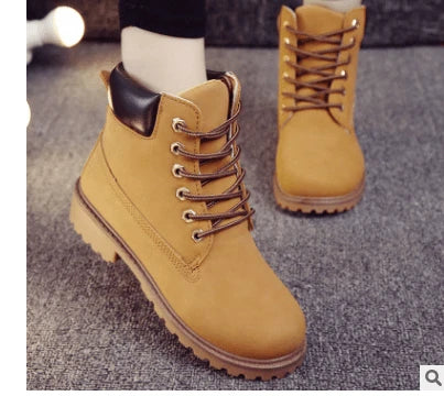 Durable lace-up ankle boots in yellow, featuring a robust rubber sole and faux leather construction for all-weather versatility.