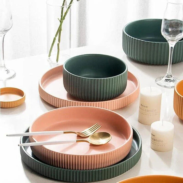 Candy-coloured ribbed ceramic tableware featuring plates, bowls, and other dining accessories in vibrant hues