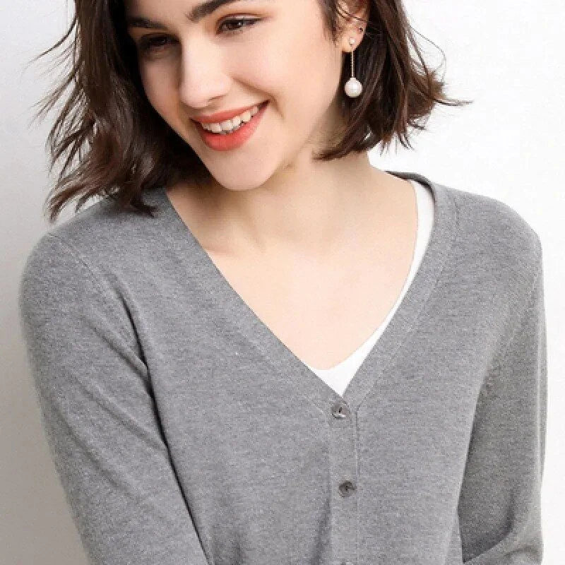 Chic v-neck single breasted cardigan in blue, green, and pink colours with a sophisticated and timeless design